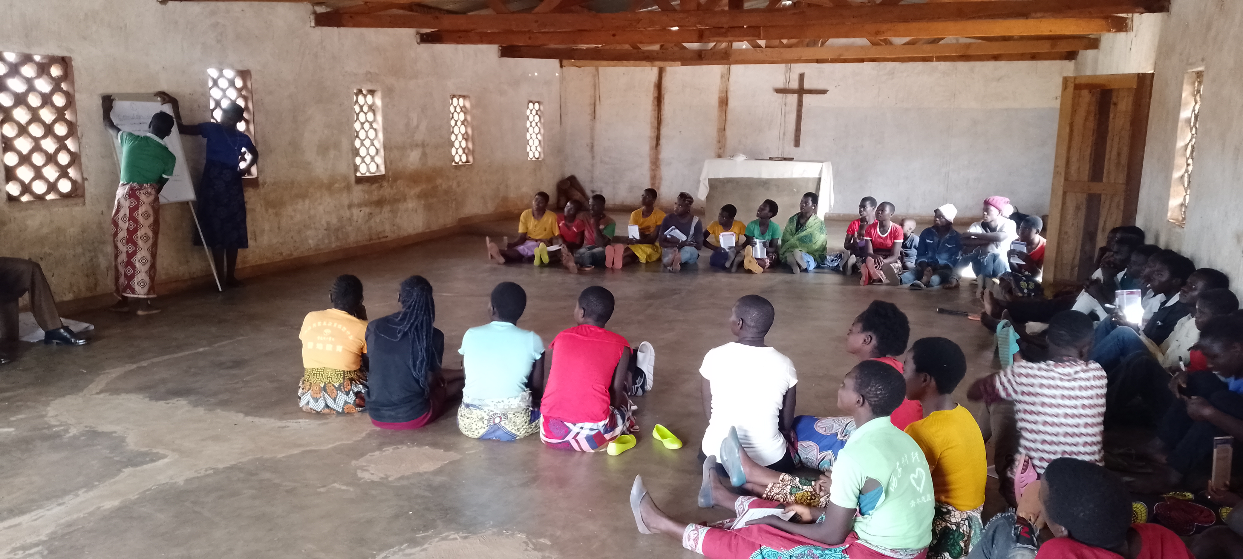 WOGRI youth club members in session in the community